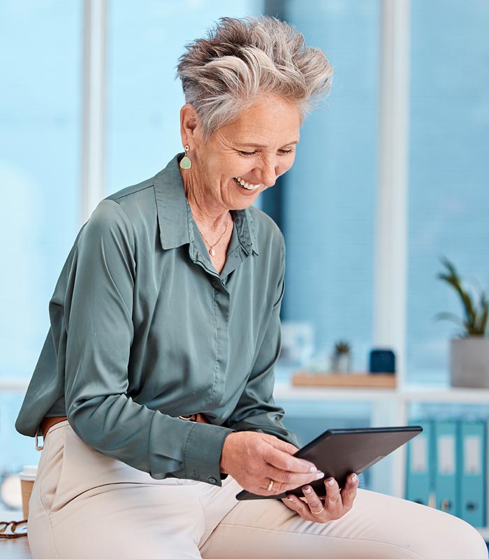 Mature professional woman looking at a tablet